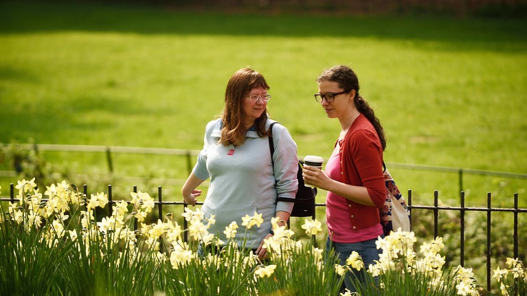 Visitors exploring the garden in June at Quarry Bank, Cheshire